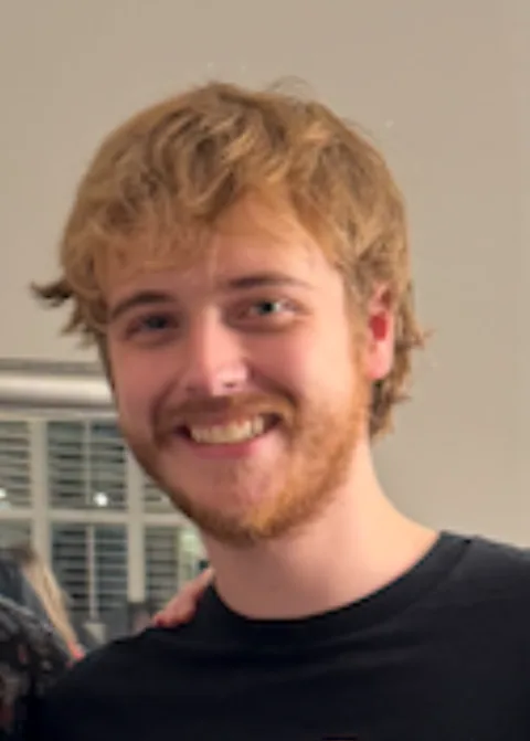 Original photo: a smiling friend with a red beard